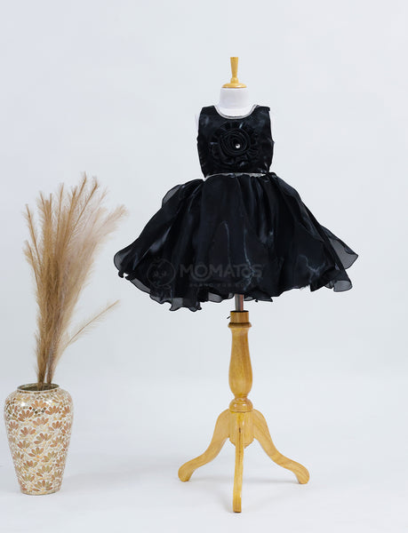 A Classic Black Frock with Single Flower Accent