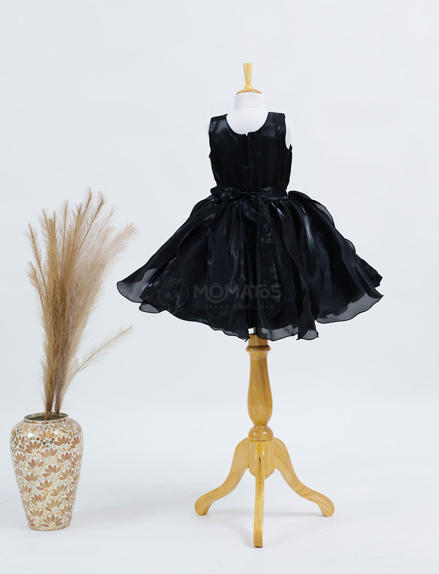 A Classic Black Frock with Single Flower Accent