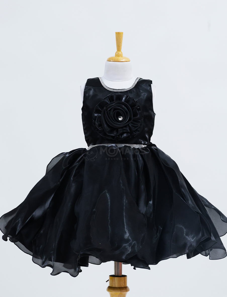 A Classic Black Frock with Single Flower Accent