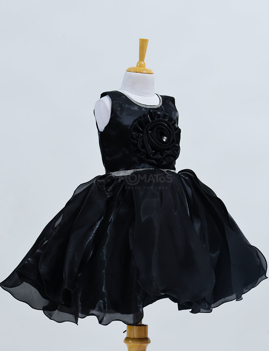 A Classic Black Frock with Single Flower Accent